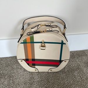 Round, plaid, crossbody handbag from the Envy Boutique
